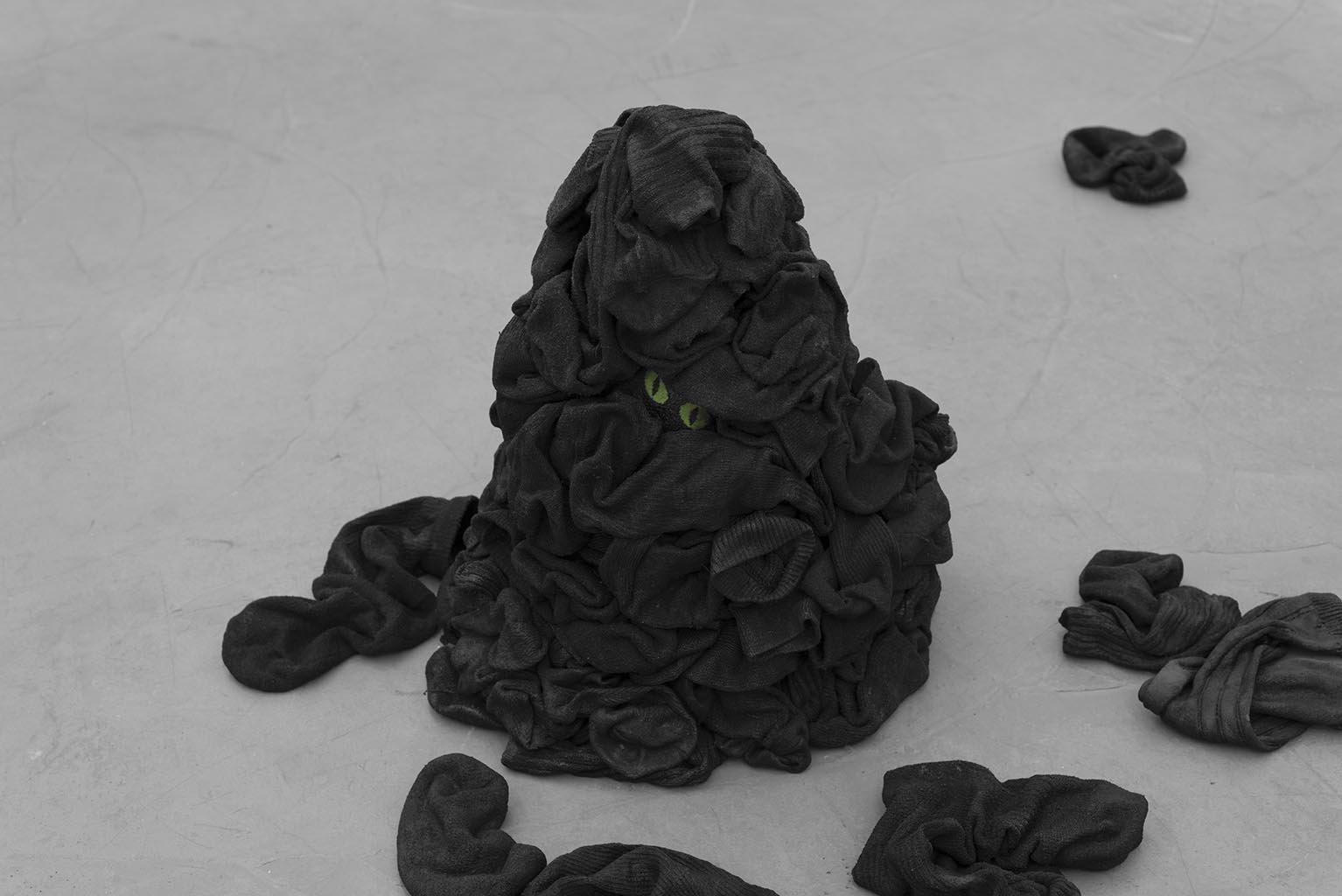 Pile, 2015, gesso, acrylic paint, fabric stiffener, dress socks, dimensions variable