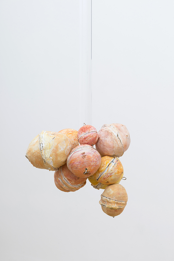 Untitled (Citrus Balls 1) Solid cast acrylic rod, various citrus fruit rinds, epoxy putty, oil pastel, stainless steel wire, and enamel; dimensions variable; 2018